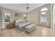 Serene bedroom with a ceiling fan, neutral walls, and natural light from large windows at 5162 Hubert St, Parker, CO 80134