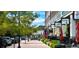 Charming street view with colorful umbrellas, potted plants, and storefronts, creating a welcoming atmosphere at 5162 Hubert St, Parker, CO 80134