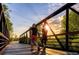 Scenic walking path with a wooden bridge, perfect for outdoor activities and enjoying nature at 5162 Hubert St, Parker, CO 80134