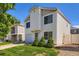 Two-story home featuring a well-maintained lawn and a one-car garage on a sunny day at 4520 Andes St, Denver, CO 80249