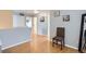 Hallway features hardwood floors and neutral paint at 4520 Andes St, Denver, CO 80249