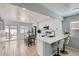 Bright and airy kitchen featuring sleek white cabinets, a breakfast bar, and stainless steel appliances at 4520 Andes St, Denver, CO 80249