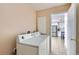 Laundry room with a washer and dryer, conveniently located near kitchen at 4520 Andes St, Denver, CO 80249
