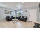 Cozy living room featuring tiled floors, modern furniture, and natural lighting at 4520 Andes St, Denver, CO 80249
