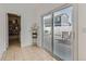 Mud Room featuring tile floors, sliding glass doors to patio, and convenient access to storage and laundry areas at 4520 Andes St, Denver, CO 80249