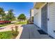 Exterior view of townhomes featuring well-manicured lawns, flower gardens, and attached garages at 4520 Andes St, Denver, CO 80249