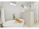 Luxurious bathroom with a soaking tub, glass-enclosed shower, and modern fixtures creating a serene oasis at 7812 Inverness Blvd, Englewood, CO 80112