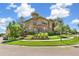 Beautiful exterior of a multi-story home with manicured landscaping, complemented by a blue sky at 7812 Inverness Blvd, Englewood, CO 80112