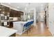 Modern kitchen featuring a central island with breakfast bar and stainless steel appliances for contemporary appeal at 7812 Inverness Blvd, Englewood, CO 80112