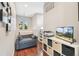 Cozy office space with a gray sofa, a TV, and a storage cube at 7812 Inverness Blvd, Englewood, CO 80112