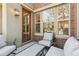 Inviting outdoor patio with seating, perfect for relaxing or entertaining at 7812 Inverness Blvd, Englewood, CO 80112