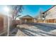 Backyard view with covered patio and ample space, perfect for outdoor living at 2881 W 65Th Ave, Denver, CO 80221