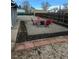 Landscaped backyard features gravel, mulch, and a seating area perfect for relaxing and enjoying the outdoors at 2881 W 65Th Ave, Denver, CO 80221