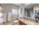 Clean bathroom with a vanity, shower, and plenty of storage at 2881 W 65Th Ave, Denver, CO 80221