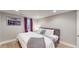 King-size bed, window, and artwork highlight this finished basement bedroom at 2881 W 65Th Ave, Denver, CO 80221