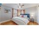Spacious bedroom with king-size bed and ceiling fan at 2881 W 65Th Ave, Denver, CO 80221