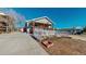 View of a well-maintained home with a charming front porch and a white picket fence at 2881 W 65Th Ave, Denver, CO 80221