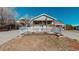 A charming home featuring a cozy front porch and a white picket fence, perfect for curb appeal at 2881 W 65Th Ave, Denver, CO 80221