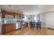 Modern kitchen with stainless steel appliances and wood flooring at 2881 W 65Th Ave, Denver, CO 80221