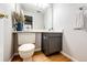Charming half-bath with wood-look flooring, a modern vanity, and stylish decor at 8231 S Fillmore Way, Centennial, CO 80122