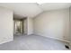 Spacious bedroom featuring neutral walls and carpet with closet space and doorway to bathroom at 8231 S Fillmore Way, Centennial, CO 80122