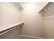 Walk-in closet with neutral walls, carpeted floor, shelving, and hanging rods at 8231 S Fillmore Way, Centennial, CO 80122