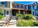 Charming townhome with a covered front porch and well-maintained landscaping at 8231 S Fillmore Way, Centennial, CO 80122