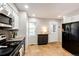 Clean kitchen features updated appliances, countertops, and tile floors at 8231 S Fillmore Way, Centennial, CO 80122