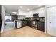 Modern kitchen features stainless steel appliances and granite countertops at 8231 S Fillmore Way, Centennial, CO 80122