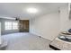 Spacious living room with a stone accent wall and large window with natural light at 8231 S Fillmore Way, Centennial, CO 80122