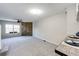 Open-concept living and dining area with a brick accent wall and natural light at 8231 S Fillmore Way, Centennial, CO 80122