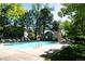 Community pool with a bath house and several chairs for residents at 8231 S Fillmore Way, Centennial, CO 80122