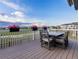 Charming back deck with a dining table and flower boxes, perfect for outdoor dining and relaxation at 16701 Buffalo Run Dr, Commerce City, CO 80022