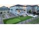 Beautifully landscaped backyard with a custom putting green, ideal for outdoor entertainment at 16701 Buffalo Run Dr, Commerce City, CO 80022