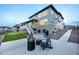 Stylish backyard with comfortable seating, a fire pit, lush turf, and a well-manicured lawn at 16701 Buffalo Run Dr, Commerce City, CO 80022