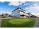 The backyard boasts a putting green and beautiful landscaping at 16701 Buffalo Run Dr, Commerce City, CO 80022