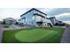 Expansive backyard featuring a putting green and lovely deck; perfect for outdoor activities and relaxation at 16701 Buffalo Run Dr, Commerce City, CO 80022