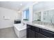 Beautiful bathroom with a free-standing tub, granite countertops, and great natural light at 16701 Buffalo Run Dr, Commerce City, CO 80022