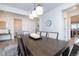 Dining room with a decorative rug, large window, and a modern farmhouse feel at 16701 Buffalo Run Dr, Commerce City, CO 80022