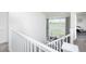 View from second floor showing a living room below with soaring ceilings and natural light at 16701 Buffalo Run Dr, Commerce City, CO 80022