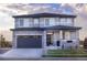 Beautifully designed home featuring a stone accents, and well-manicured lawn at 16701 Buffalo Run Dr, Commerce City, CO 80022