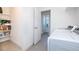 Bright laundry room with open shelving, washer and dryer at 16701 Buffalo Run Dr, Commerce City, CO 80022