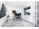 A bright home office featuring a neutral palette, modern desk, and outdoor views at 16701 Buffalo Run Dr, Commerce City, CO 80022