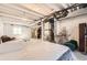 Unfinished basement features exposed ceiling beams, white walls, and ample storage space at 39286 Hart Cir, Elizabeth, CO 80107