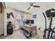 Home office with ceiling fan, computer, and desk next to window with natural light at 39286 Hart Cir, Elizabeth, CO 80107