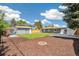 Landscaped backyard featuring a fire pit and patio, great for relaxing and enjoying outdoor activities at 309 W Oak St, Lafayette, CO 80026