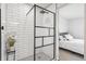 Modern bathroom showcasing a glass shower with subway tile and black accents, blending style and functionality at 309 W Oak St, Lafayette, CO 80026