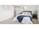 Bright bedroom featuring a sliding barn door, natural light, and a modern decor with blue accents at 309 W Oak St, Lafayette, CO 80026