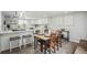 Open-concept kitchen and dining room with breakfast bar and modern decor at 309 W Oak St, Lafayette, CO 80026