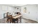 Elegant dining room showcasing a stone fireplace and a table set for a meal, blending modern and rustic charm at 309 W Oak St, Lafayette, CO 80026